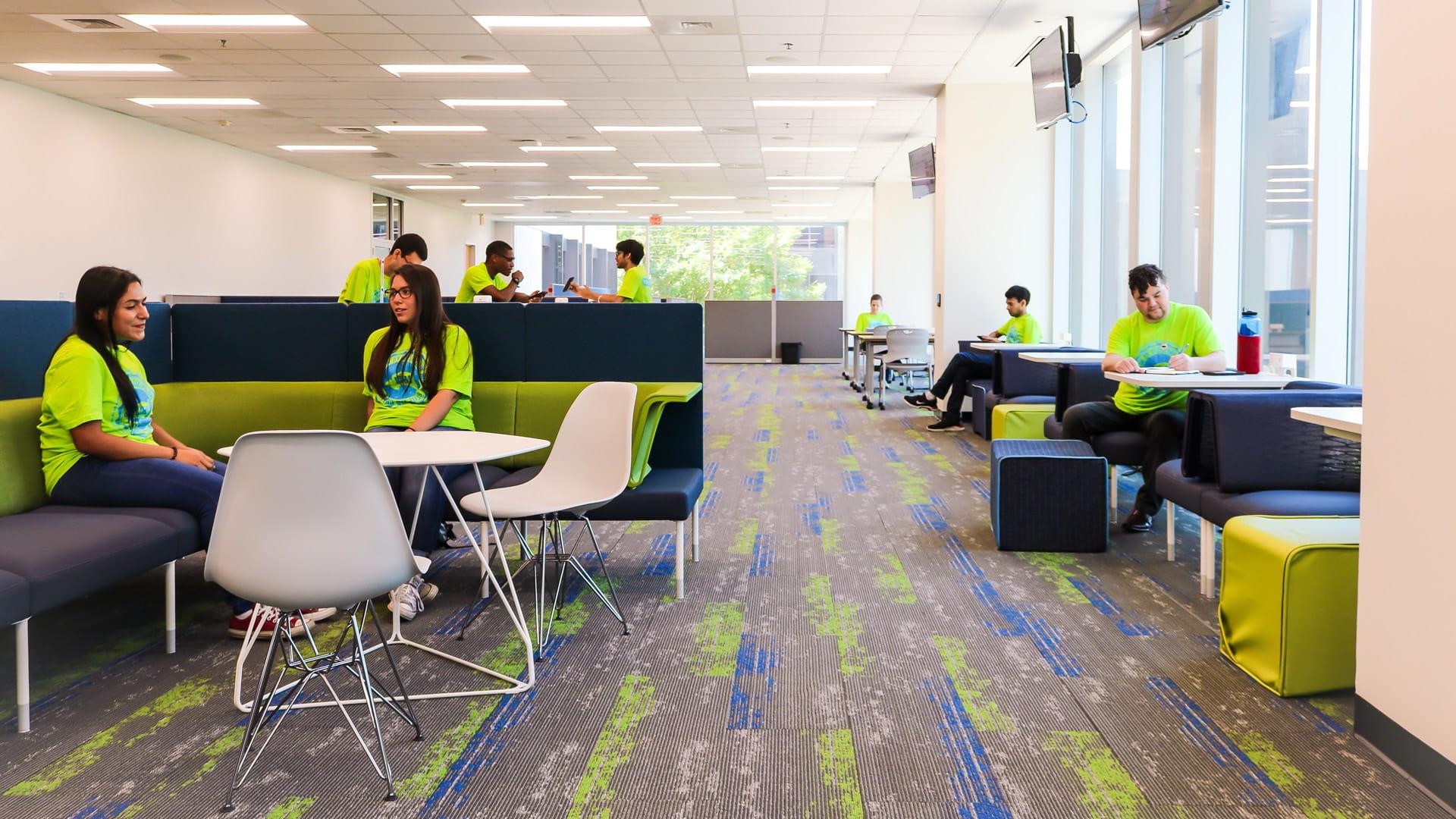 Students writing, reading, and chatting in the SSCB Student Organizatioon Center and Lounge